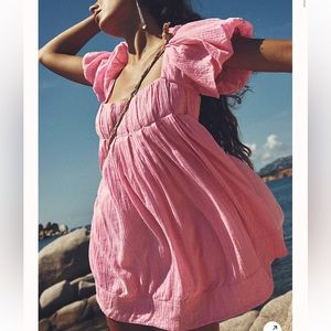 Pink puff-sleeve shift dress.